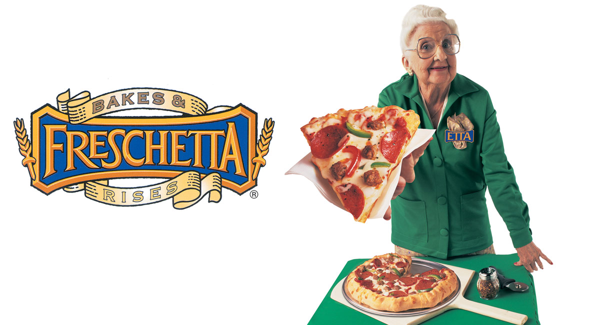 Etta the sample lady holds out a slice of Freschetta® pizza