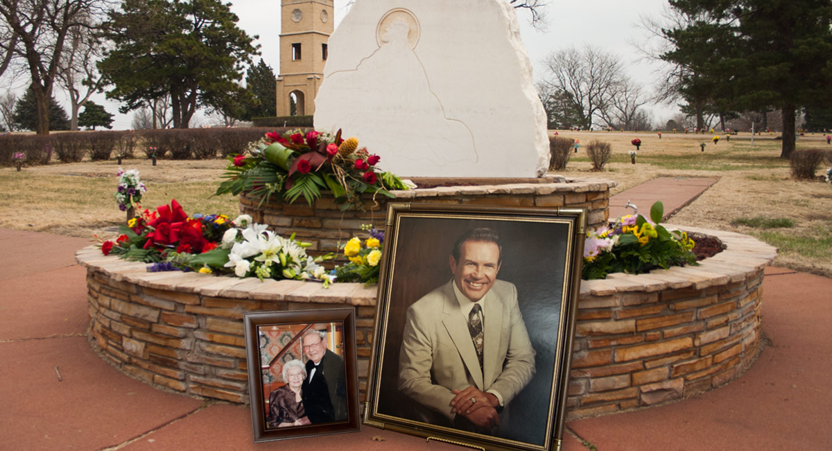 Flowers and photographs decorate Alfred Schwan's memory