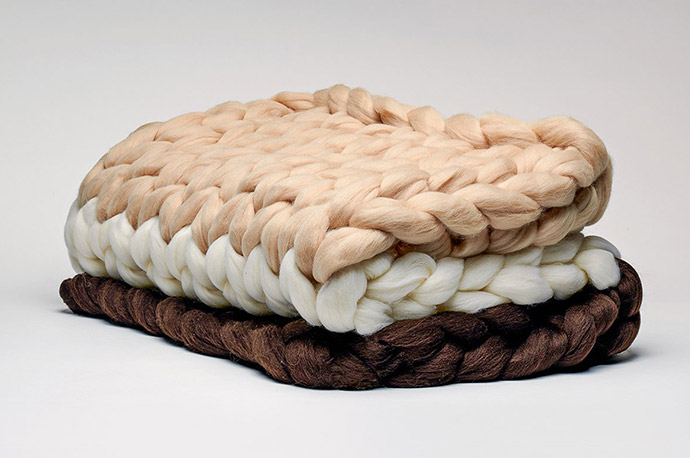 A folded Edwards Desserts Confection Collection Chocolate Creme Extra-Rich Hand-Knit Blanket